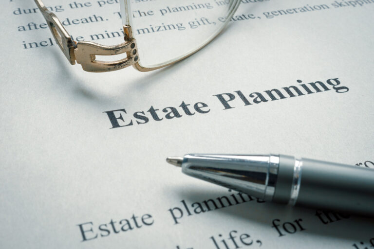 estate-planning-attorney-winston-salem A piece of paper that says “Estate Planning” with a pen on top of it in Winston-Salem.